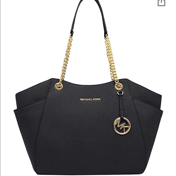 Gold Michael Kors lettering and leather exterior. - Picture 1 of 1